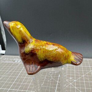 Vintage Niagara Falls Canada Ceramic Seal Figurine Brown & Yellow